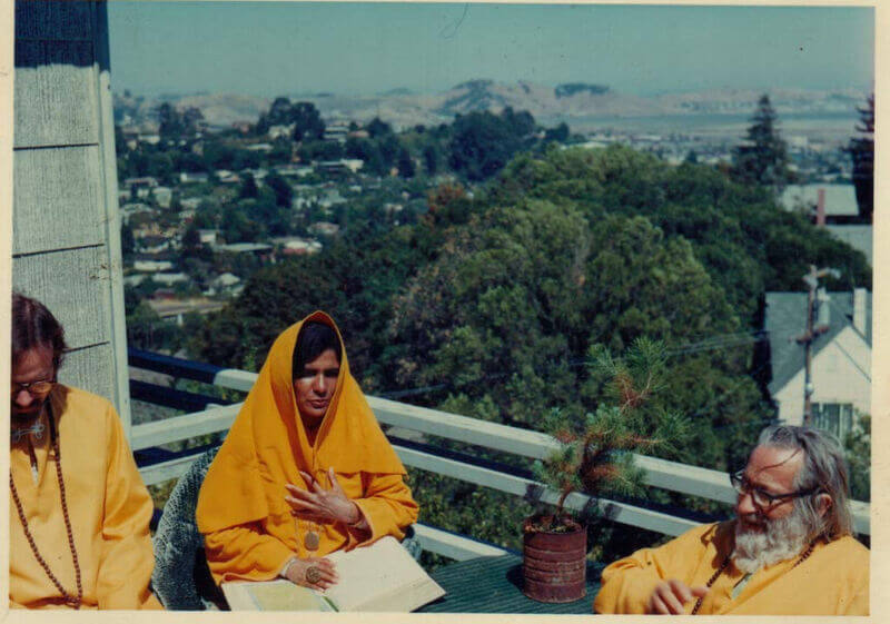 Murshid Sam sitting with Moineddin and his God-Daughter Saadi on the porch of the Garden of Allah